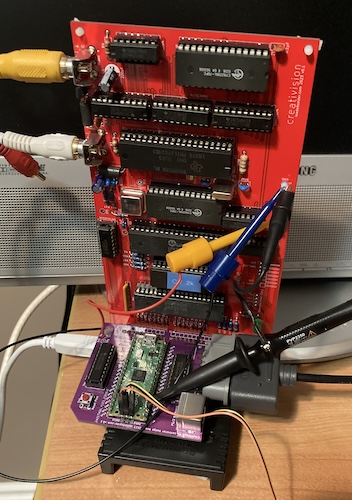 The board stack is standing on its end, being held up by the game cartridge.