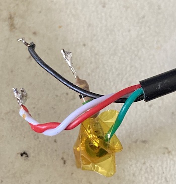 The TRRS harness, desoldered from the machine. A kapton-taped 75-ohm resistor is still dangling off the end of the video input wire, in green.