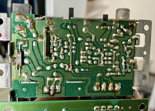 The bottom of the RF box. There are a surprising number of surface-mount components in here. There's also a 1.5A fuse.