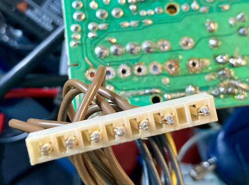 The brown supply connector is desoldered from the old PSU PCB.