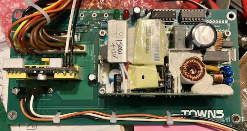 The Meanwell is installed on the right, and the PicoPSU is installed on the left.
