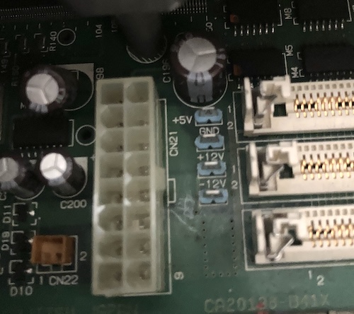 The four test points on the motherboard, for +5V, GND, +12V and -12V