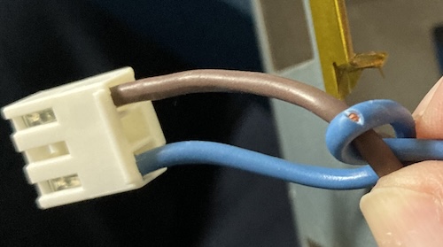 Copper is exposed from the blue neutral wire.
