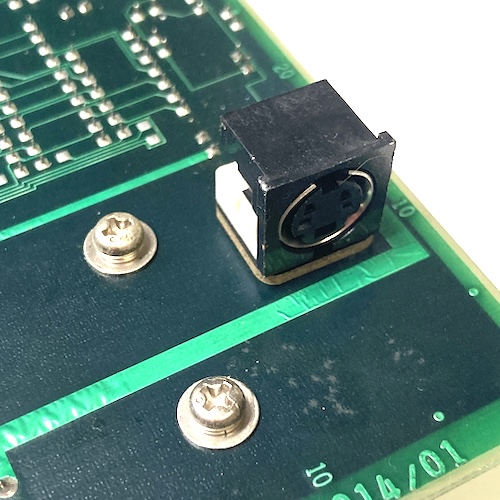 The backside of the card has a 4-pin mini-DIN female connector stuck in it.