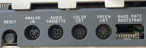 The ports on the left have a Reset button, Analogue In, Audio Cassette, Colour CRT, Green CRT, Baud Rate/Bootstrap.