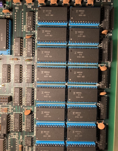 A huge quantity of MB8364 ROMs are stuck into bright blue sockets.