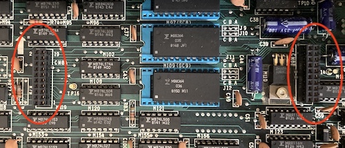 Two expansion headers are circled. They are each 2x10 pins, and appear to be 2.54mm/0.1" pin spacing. An arrow points towards the top of the machine to indicate which way boards should be installed.