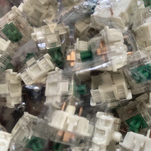 A bag of Gateron green switches up close. Notice how many pins they have. That's important later.
