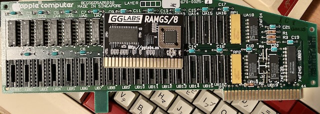 A RAMGS/8 card sits on top of an Apple 670-0025 RAM expansion card, which in turn sits on a Famicom keyboard. The new RAMGS card is just barely as large as the edge connector.