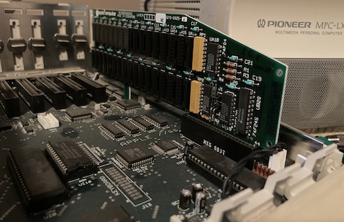 A RAM card is inserted into the rightmost "memory expansion" slot.