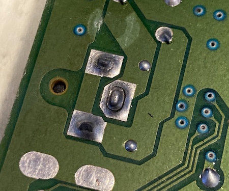 The solder on all three pads of the Mega Drive's power barrel jack is cracked.