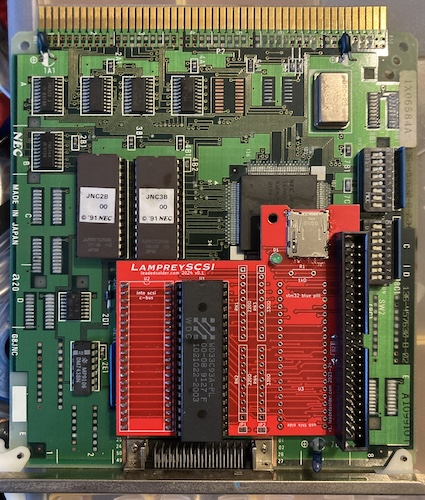 A "LampreySCSI" board sits on top of a PC-98 C-Bus SCSI card, with a header and an unpopulated Blue Pill footprint.