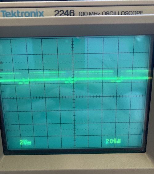 A composite output signal is displayed on the Tektronix 2246 oscilloscope screen. It looks kind of a train made of fuzzy mustaches.