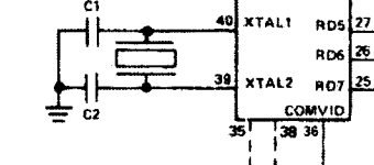 The correct crystal setup from the TMS9918 datasheet. The load caps go between the crystal and ground now.