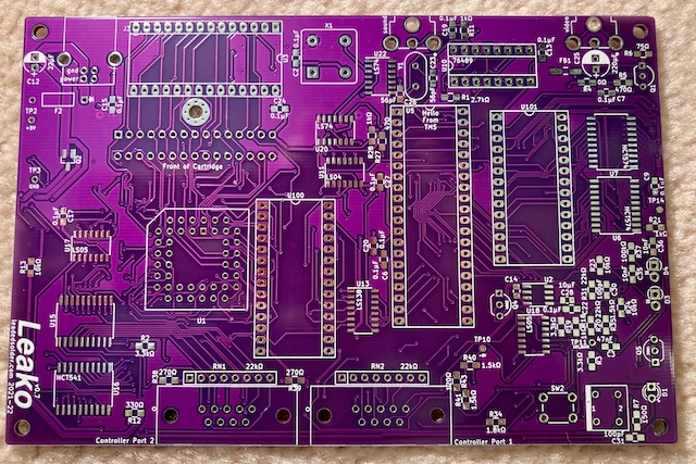 A bare Leako v0.7 PCB, in purple. Notice all the extra silkscreen.