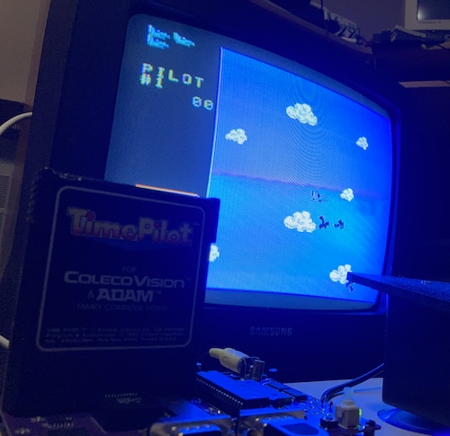 A very blue-washed picture of the Leako playing Time Pilot from an original cartridge, with my joystick attached.