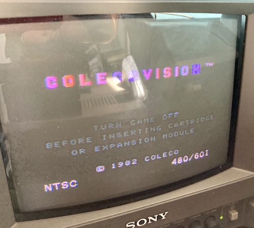 The ColecoVision BIOS screen has come up. It says "Turn game off before inserting cartridge or expansion module, © 1982 Coleco."