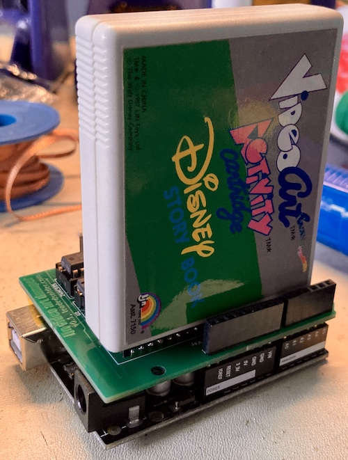The cartridge is loaded into the fully populated board, stacked on top of the Arduino Uno clone.