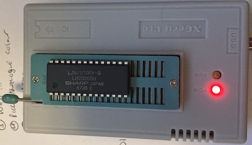 The mask ROM is now installed into the TL866 EPROM reader. A single red light is illuminated for power.