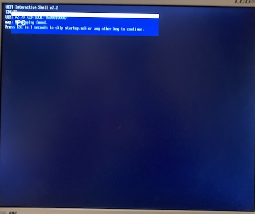 The Samsung 910MP LCD is letting me know that it is viewing the "PC" input, which is obscuring the actual UEFI sign-on message from the computer. Top work, Samsung.