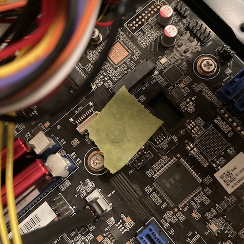 Some green painter's tape is covering the buzzer.