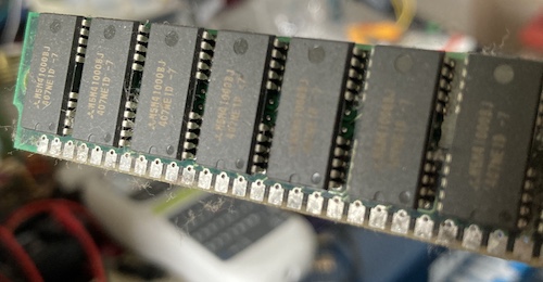 Tarnished (and hairy) tin fingers on the 30-pin RAM SIMMs.