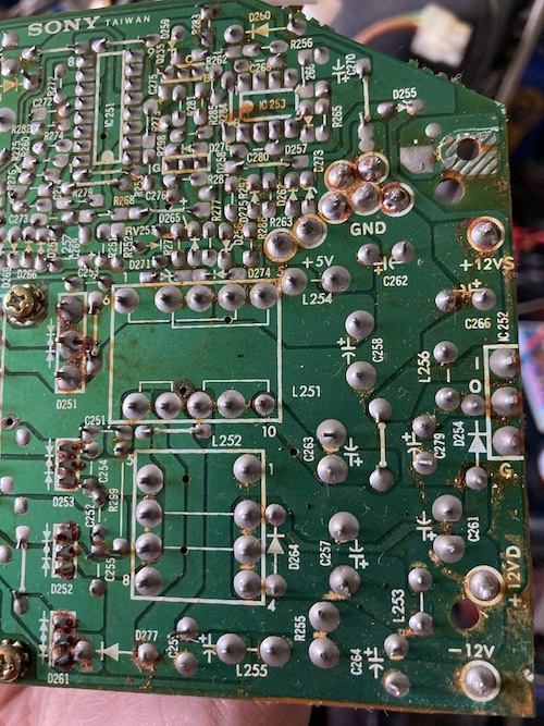Rusty crap on the solder joints of the power supply. Nothing dramatic.