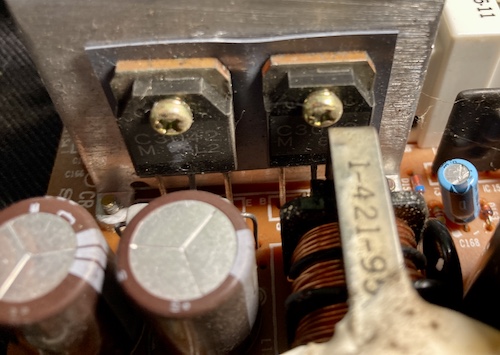 Surface rust on two of the c3042 switching transistors. You can see the start of a spider web on the right.