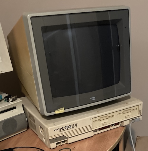 The Fujitsu monitor is sitting on top of the PC-9801UV.