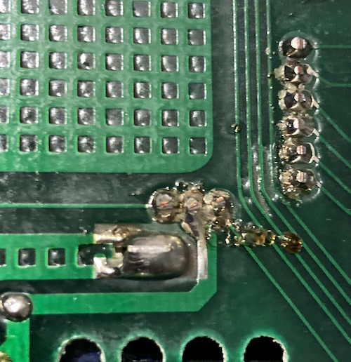 There is a bunch of goopy flux around the RF modulator's input pins.