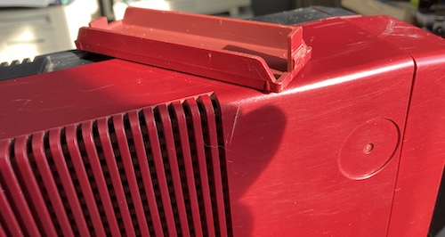 The plastic drive cover, sitting on top of the case in the sun. You can see all the scratches on the plastic.