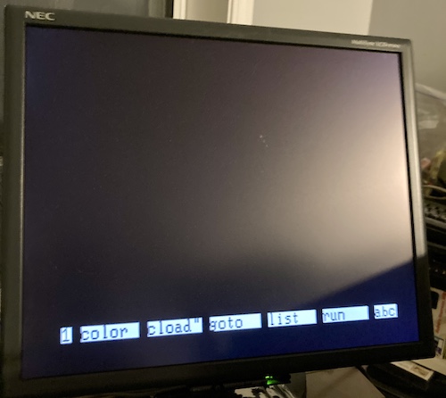 The Mr.PC is attempting to boot. The screen just looks like NEC PC-6001 disk BASIC, indicating it is on page 1, with the quick commands for color, cload, goto, list, run present. It is also indicating it is in the Western character set.