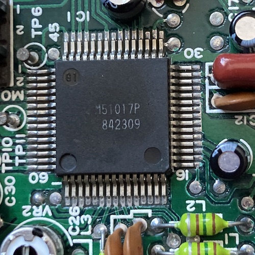 A close-up of the M51017P QFP gate array chip on the logic board. The date code reads 842309.