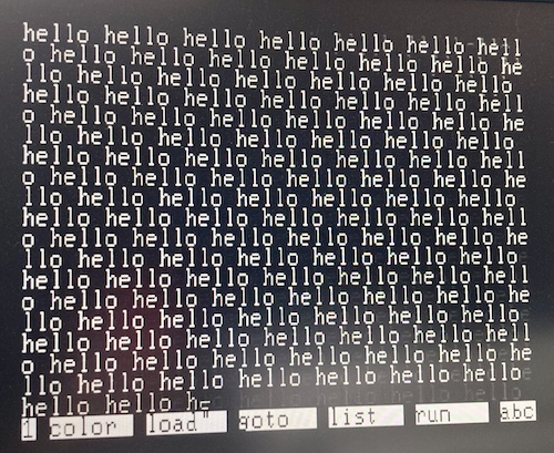 The Hello World BASIC program is running very quickly. The text is blurred.