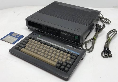 A picture of a complete, black, PC-6601SR with keyboard, video cables, and a floppy disk. Someone please lock up my credit card.