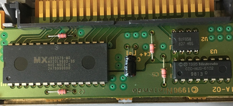 The cartridge has a regular old MX23L9502-35 mask ROM, a capacitor, a component marked BU9850, and a Nintendo CIC protection chip CIC-NUS-6102.