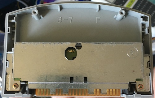 The cartridge has an RF shield with screws holding it together.