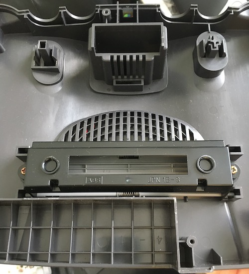 The cartridge tray is held in place by two Phillips head screws. You can see that it is also labelled as "JPN" for Japan market.