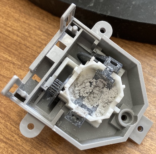 This joystick bowl is full of shavings of joystick parts.