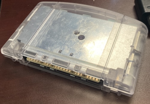 The assembled N64 PicoCart cartridge, in transparent plastic. You can tell that the plating is not especially shiny on the internal shields.