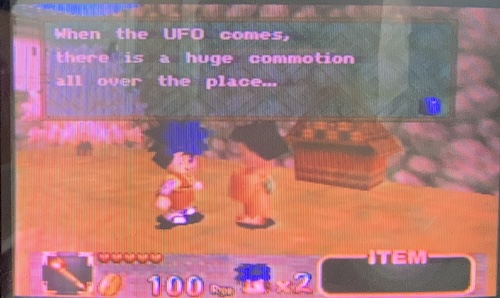 A villager and Goemon wiggle at each other while discussing the local real estate situation. Specifically, the villager says "When the UFO comes, there is a huge commotion all over the place..."