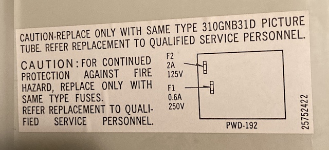 The sticker reads: Caution, replace only with same type 310GNB31D picture tube. Refer replacement to qualfied service personnel. Caution: for continued protection against fire hazard, replace only with same type fuses. Refer replacement to qualified service personnel. Two arrows point to two fuses on an outline of the board. Part number 25725422