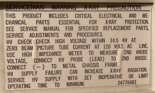 The somewhat sexist sticker on the inside of the case reads: Serviceman Warning, X-Ray Precaution.