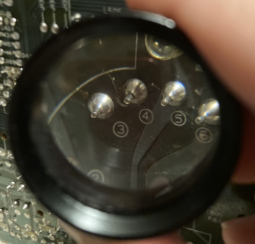 The number-four pin on the flyback transformer has a dark ring on it, indicating a potential bad solder joint.