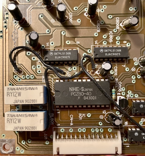 The Micom board's predominant NHE-S PCZ80-40 24-pin microcontroller. Two Takamisawa micro-relays sit next to it.