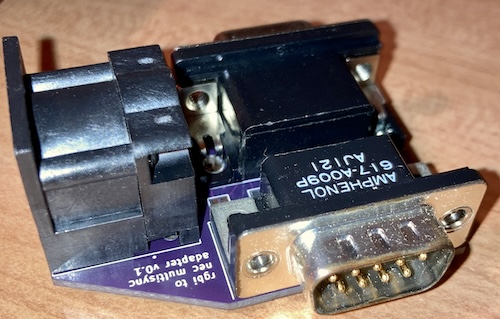 The assembled adapter, showing the HD15 MultiSync connector and the 8-pin DIN.