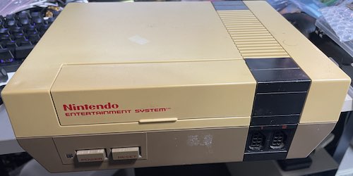 The NES is reassembled: it looks like any other yellowed NES from the outside.