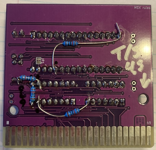 Four bodged 10k resistors are going from the various paged address pins to ground. You can also see my sharpie mark indicating that the mounting hole is too dang small.