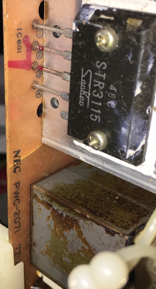 The crack in the board near the STR3115 voltage regulator.