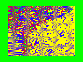 The image is now displayed around a green border, running in the MAME emulator. It looks surprisingly close to the original image despite only using eight garish colours.